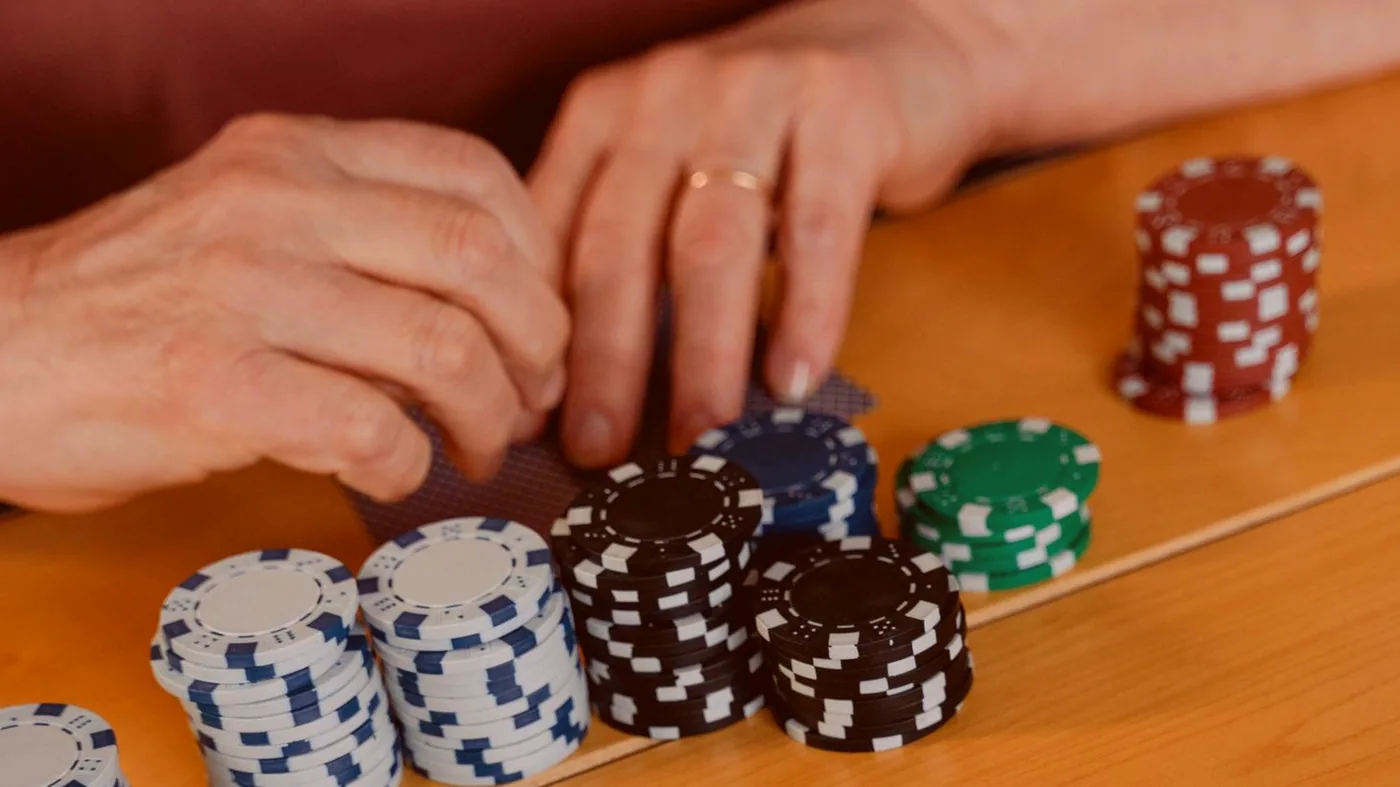 Close view of a card table with chip stacks set for play